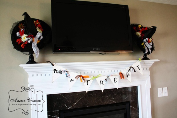 Halloween mantle with decorative witch hats and trick or treat pennant banner